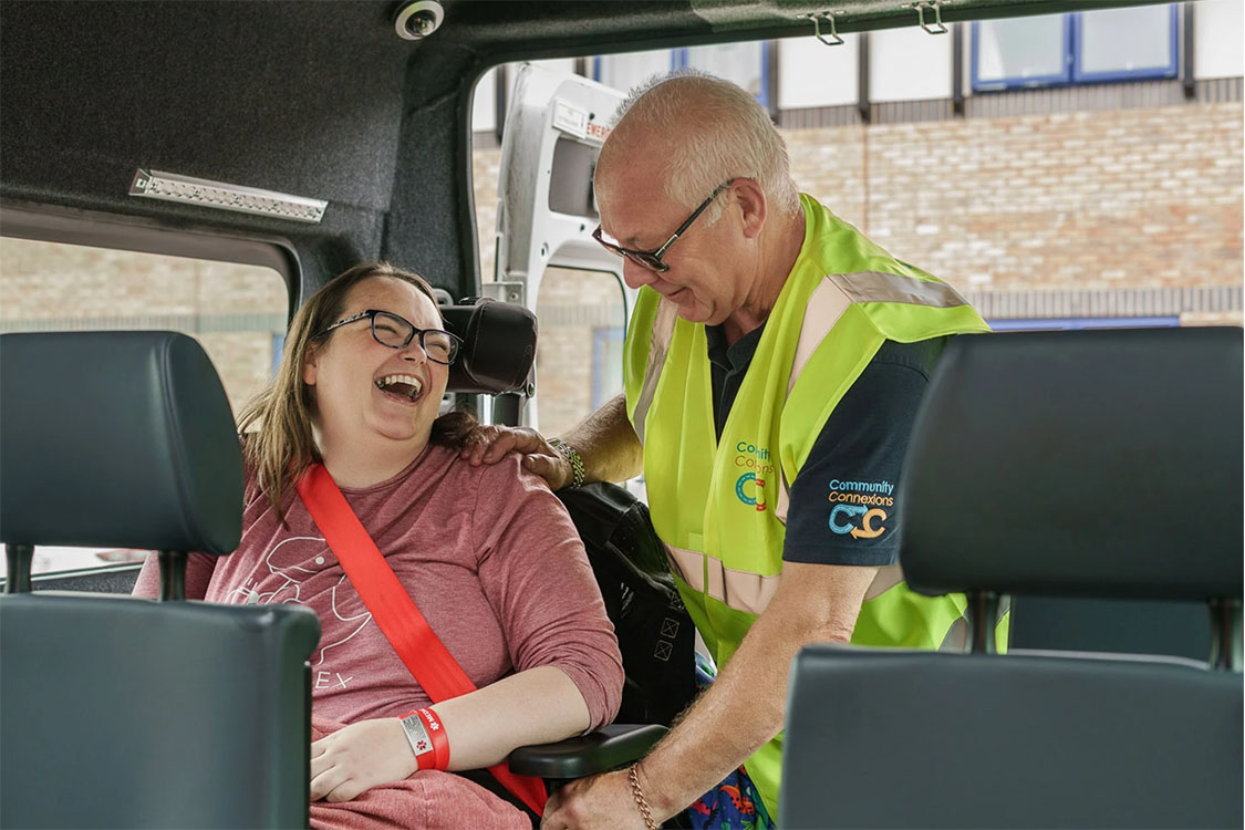 Community Connexions driver Martin, and passenger Beka arriving at the supermarket in Community Connexions bus