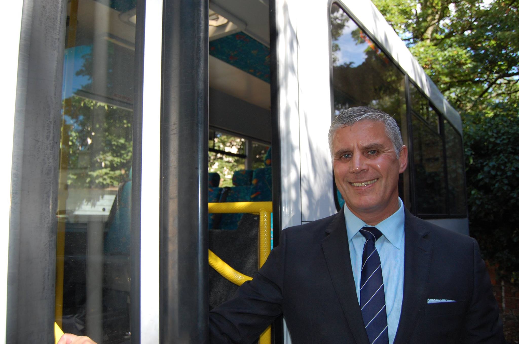 CEO, Paul Riddick alongside Community Connexions bus